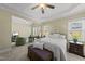 This main bedroom has a sitting area and a large window for ample natural light at 129 Camille Cir, Youngsville, NC 27596
