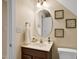 Bathroom featuring a vanity with an oval mirror and decorative art at 1335 Saint Andrews Dr, Mebane, NC 27302