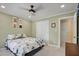 Cozy bedroom features a ceiling fan, closet, and playful animal art at 1335 Saint Andrews Dr, Mebane, NC 27302