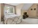Bright bedroom with a bed, TV stand, and window at 1335 Saint Andrews Dr, Mebane, NC 27302