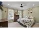 Charming bedroom with a ceiling fan, dresser, and bright windows at 1335 Saint Andrews Dr, Mebane, NC 27302