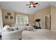 Bonus room with a sofa, window, and treadmill at 1335 Saint Andrews Dr, Mebane, NC 27302
