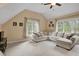 Bonus room with a vaulted ceiling and a comfortable sectional sofa at 1335 Saint Andrews Dr, Mebane, NC 27302