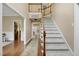 Elegant foyer with a staircase and hardwood floors flows into the main living spaces at 1335 Saint Andrews Dr, Mebane, NC 27302