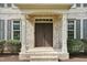 Inviting front entrance boasting a double door, brick steps, and covered portico at 1335 Saint Andrews Dr, Mebane, NC 27302