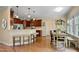 Kitchen with bar seating open to the breakfast nook and dining table at 1335 Saint Andrews Dr, Mebane, NC 27302