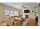 Bright living room with fireplace and large windows at 1335 Saint Andrews Dr, Mebane, NC 27302