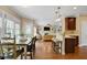 Open living space with dining table and kitchen bar stools at 1335 Saint Andrews Dr, Mebane, NC 27302