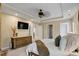 The main bedroom features a ceiling fan and a cozy seating arrangement with soft decor at 1335 Saint Andrews Dr, Mebane, NC 27302