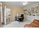 Comfortable office featuring built-in bookshelves, neutral paint and soft carpet at 1335 Saint Andrews Dr, Mebane, NC 27302