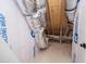 Exposed attic showing building wrap, ductwork, and the home's construction materials at 1394 Delma Grimes Rd, Coats, NC 27521