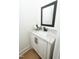 Stylish powder room features a modern vanity with granite countertop and sleek fixtures at 1394 Delma Grimes Rd, Coats, NC 27521