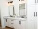 Bright bathroom with double vanity, granite counters, and modern fixtures at 1394 Delma Grimes Rd, Coats, NC 27521