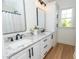 Bright bathroom with double vanity, granite counters, and modern fixtures at 1394 Delma Grimes Rd, Coats, NC 27521