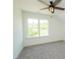 Bright bedroom features a large window, plush carpet, and ample natural light at 1394 Delma Grimes Rd, Coats, NC 27521