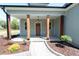 Inviting front porch with wooden beams and craftsman details at 1394 Delma Grimes Rd, Coats, NC 27521
