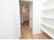 Bright hallway features sleek wood floors, modern lighting, and easy access to the home's front door at 1394 Delma Grimes Rd, Coats, NC 27521