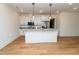Modern kitchen featuring a center island with granite countertops at 1394 Delma Grimes Rd, Coats, NC 27521