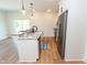 Modern kitchen featuring a center island with granite countertops at 1394 Delma Grimes Rd, Coats, NC 27521