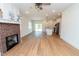 Spacious living room featuring a cozy fireplace and bright, open layout at 1394 Delma Grimes Rd, Coats, NC 27521