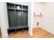 Mudroom featuring a green storage cubby and white storage cabinet at 1394 Delma Grimes Rd, Coats, NC 27521