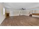 Finished basement featuring hard surface floors, a faux fireplace, and painted brick accent wall at 1410 Cross Link Rd, Raleigh, NC 27610