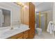 Bathroom featuring a vanity, mirror, shower with glass door, and toilet at 1410 Cross Link Rd, Raleigh, NC 27610