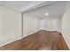 Spacious living room showcasing hardwood floors and neutral wall color at 1410 Cross Link Rd, Raleigh, NC 27610