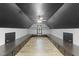 Finished attic space with dark painted ceiling and custom cabinets on each side at 144 W Walker Woods Ln, Clayton, NC 27527