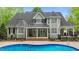 Lovely home backyard featuring an in-ground pool, manicured landscaping and an inviting outdoor space at 144 W Walker Woods Ln, Clayton, NC 27527