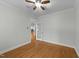 A bedroom featuring hardwood flooring and neutral walls at 144 W Walker Woods Ln, Clayton, NC 27527