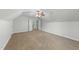 Bedroom featuring neutral carpeting, vaulted ceiling, and a double door closet at 144 W Walker Woods Ln, Clayton, NC 27527