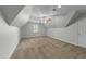 Spacious bedroom showcasing a vaulted ceiling, ceiling fan, and neutral carpeting at 144 W Walker Woods Ln, Clayton, NC 27527