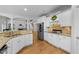Contemporary kitchen featuring stainless steel appliances, granite countertops, and white cabinetry at 144 W Walker Woods Ln, Clayton, NC 27527