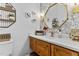 Modern bathroom with granite countertop, a wood vanity, and decorative mirror at 1506 Gormly Cir, Sanford, NC 27330