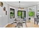 Cozy dining area with hardwood floors and views of the outdoor greenery at 1506 Gormly Cir, Sanford, NC 27330