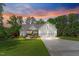 Charming two-story farmhouse with landscaped yard and a three-car garage at 1506 Gormly Cir, Sanford, NC 27330