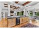 Spacious open-concept kitchen featuring wood cabinets and adjacent dining area at 1506 Gormly Cir, Sanford, NC 27330