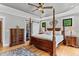 Large main bedroom with trey ceiling, wood flooring, and open closet at 1506 Gormly Cir, Sanford, NC 27330
