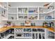 Walk-in pantry with white shelves and a natural wood countertop at 1506 Gormly Cir, Sanford, NC 27330