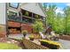 Charming patio area with wood storage, seating, and a garden at 1506 Gormly Cir, Sanford, NC 27330