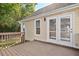 Backyard deck with wood railing and adjacent to the house at 1601 Entheos Ln, Raleigh, NC 27610
