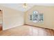 Large bedroom features a vaulted ceiling, ceiling fan, and a multi-pane window at 1601 Entheos Ln, Raleigh, NC 27610
