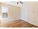Bedroom with window, closet and hardwood floors at 1601 Entheos Ln, Raleigh, NC 27610