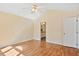 Spacious bedroom with vaulted ceiling, and ensuite bathroom at 1601 Entheos Ln, Raleigh, NC 27610