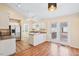 Bright kitchen with white cabinets, stainless steel appliances, and backyard access at 1601 Entheos Ln, Raleigh, NC 27610