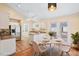 Eat-in kitchen featuring white cabinets, stainless steel appliances, and a breakfast nook at 1601 Entheos Ln, Raleigh, NC 27610