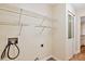 Functional laundry room features wire shelving for storage convenience and organization at 1601 Entheos Ln, Raleigh, NC 27610