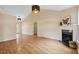 Spacious living room featuring a fireplace, hardwood floors, and ample natural light at 1601 Entheos Ln, Raleigh, NC 27610