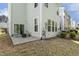 Rear of property featuring a patio, lawn, and architectural details of the home's exterior at 1614 Brussels Drive Dr, Apex, NC 27502